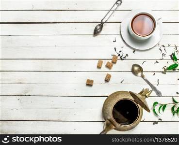 Aromatic Indian tea. On a white wooden table. Aromatic Indian tea.