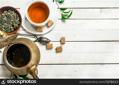 Aromatic Indian tea. On a white wooden table. Aromatic Indian tea.