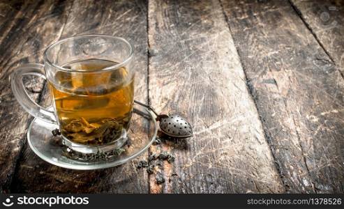 Aromatic Indian tea. On a wooden background.. Aromatic Indian tea.