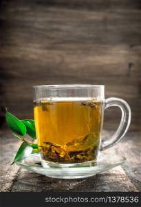 Aromatic Indian tea. On a wooden background.. Aromatic Indian tea.
