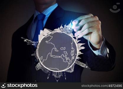 Around the world. Businessman drawing with pencil travelling concept on screen