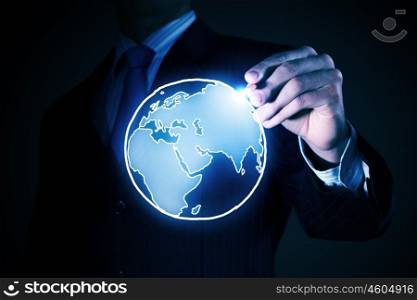 Around the world concept. Chest view of businessman drawing on screen concept of traveling