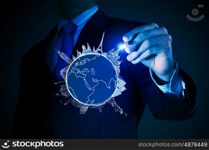 Around the world concept. Chest view of businessman drawing on screen concept of traveling