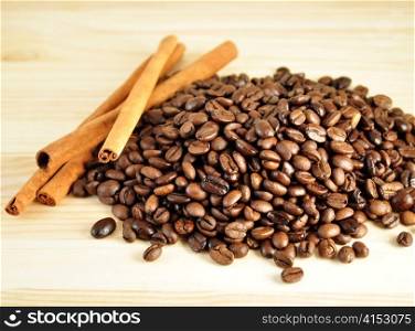 arrangement of coffee beans and cinnamon sticks