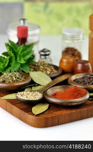 arrangement of spices on a wooden board , close up