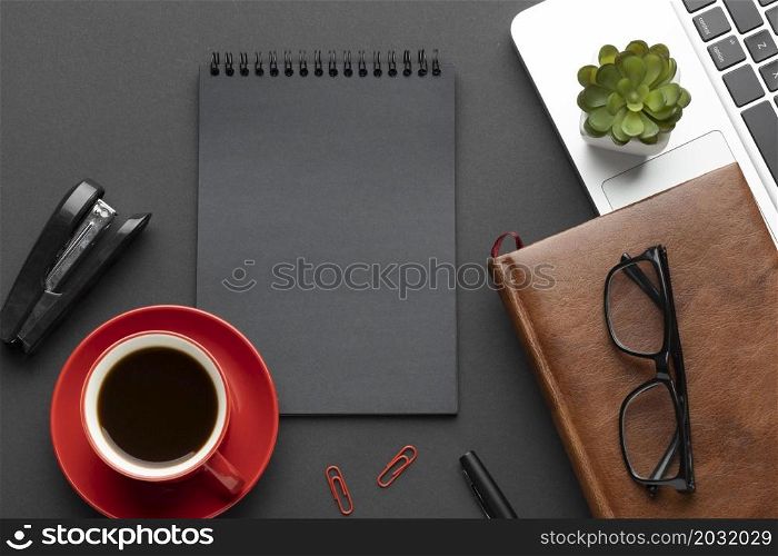 arrangement office elements dark background with notepad