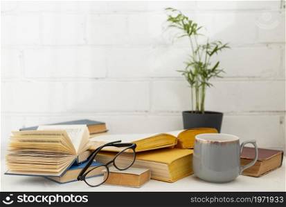 arrangement with books cup. High resolution photo. arrangement with books cup. High quality photo