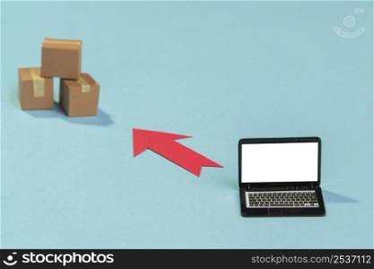 arrangement with boxes laptop