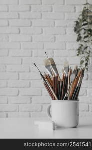 arrangement with brushes pens cup