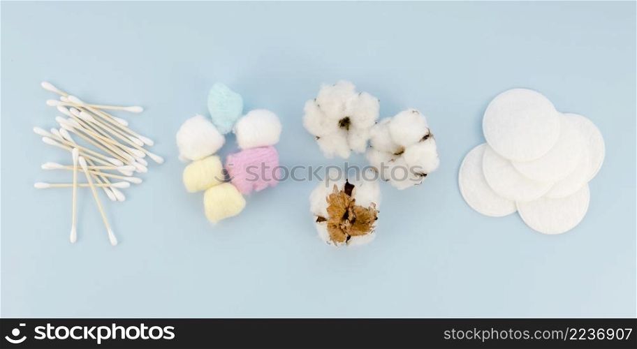 arrangement with cotton items blue background