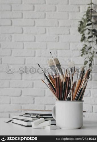 arrangement with pens brushes cup