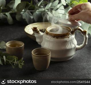 arrangement with teacup hot tea