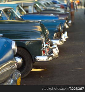 Array of antique taxi cabs parked, Havana, Cuba