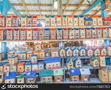 array of handmade birdhouses for sale