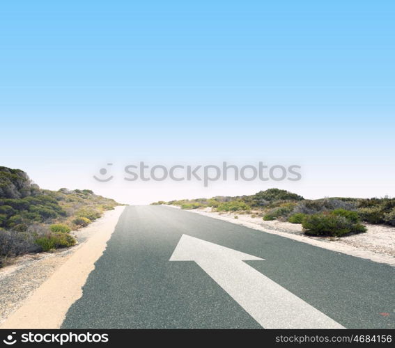 Arrow on road. Image of road and arrow on asphalt pointing direction