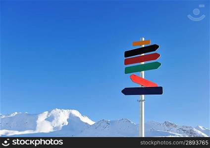 Arrow sign at mountains with snow in winter, Val-d&acute;Isere, Alps, France