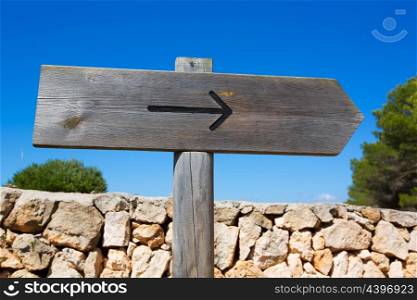 Arrow wooden track blank road sign in Mediterranean Balearic islands
