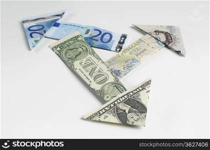 Arrows made of folded banknotes