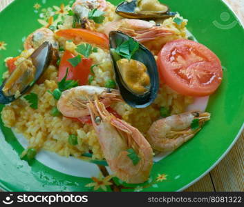 Arroz a la tumbada traditional Mexican dish prepared with white rice and seafood.