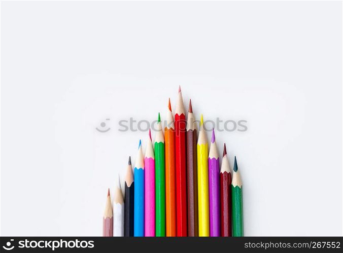 Art and drawing creative concepts of colorful crayon pencils with triangle shape on white background with copy space. Top view, Close-up, For banner design.