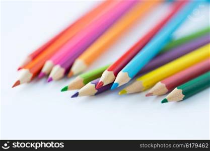 art, color, drawing, creativity and object concept - close up of crayons or color pencils