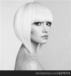 Art fashion studio portrait of beautiful blonde with short haircut