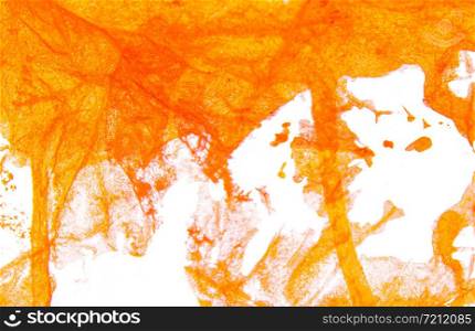 Art hand brush splashing orange color on white background.