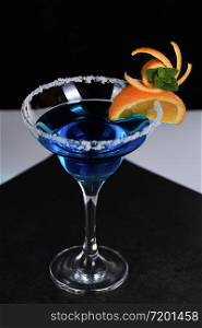 Art in orange- fruits carving. How to make to citrus garnish design for a drink. Cocktail Blue lagoon