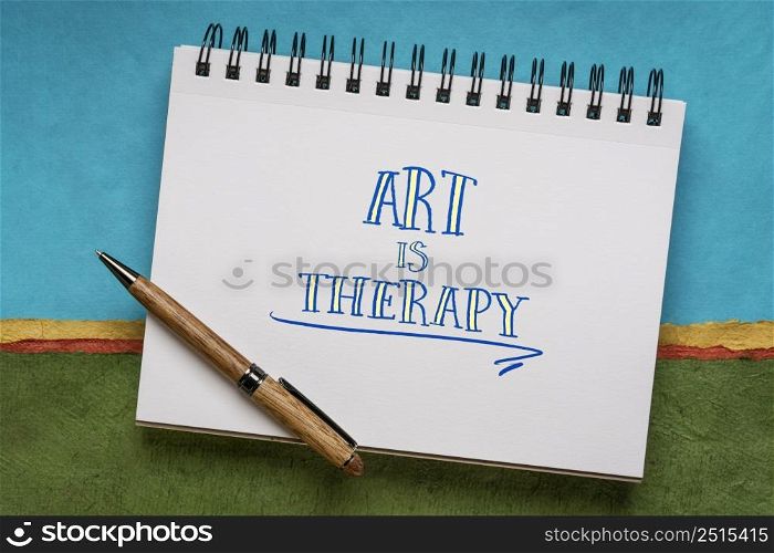 art is therapy - handwriting in a notebook against colorful abstract landscape, explore emotions, reduce anxiety, increase self-esteem, and resolve other psychological conflicts