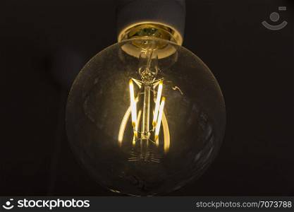 art of lighting of incandescent bulb. Close