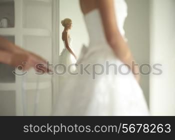 Art photo of a beautiful bride. Dressing gowns