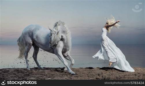 Art photo of the woman with the strong horse