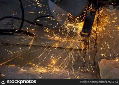 Art view of Grinding sparks from metal. Industry concept