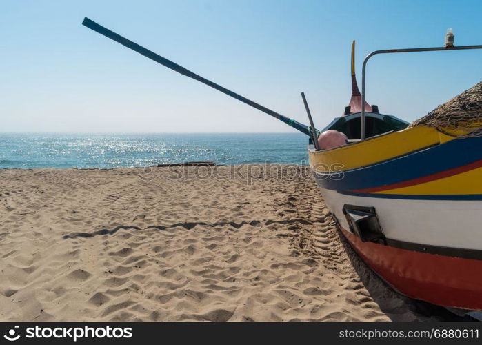 Arte Xavega typical portuguese old fishing boat on the beach in Paramos, Espinho, Portugal.