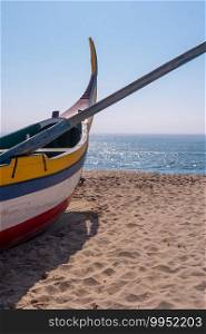 Arte Xavega typical portuguese old fishing boat on the beach in Paramos Espinho Portugal.