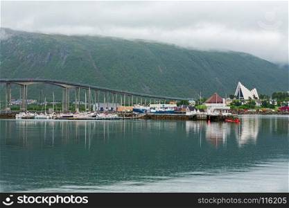 Artic cathedral and bridge in Tromso in a cloudy day, Norway. Artic cathedral and bridge in Tromso, Norway