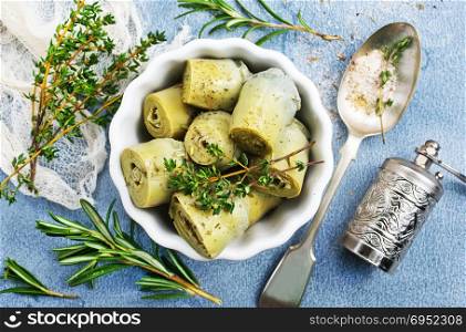 artichoke with marinad in bowl, artichoke with aroma spices