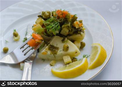 Artichokes filled with potatoes, peas, onions, carrots. Delicious healthy vegetarian food.