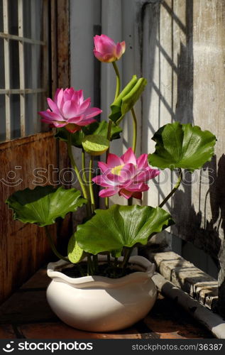 Artificial flower, handmade lotus flower with green leaf and pink petal make from clay, diy art product for home decoration