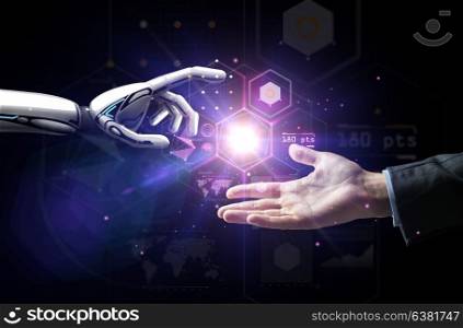 artificial intelligence, future technology and business concept - robot and human hand with flash light and virtual screen projection over black background. robot and human hand over virtual projection