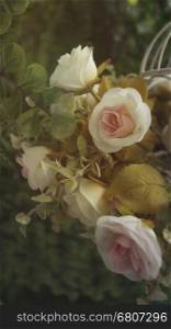 artificial rose flower bouquet in vintage tone and soft focus