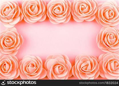 artificial roses on pink background, mock-up image with space for text