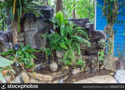 Artificial waterfall decorate in resort .Thailand