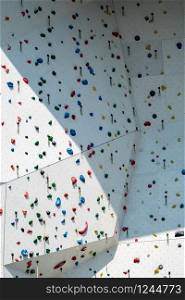 Artificially designed climbing Wall. Climbing wall with colorful rocks.. Climbing wall with colorful rocks