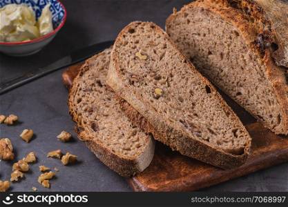 Artisan fresh sourdough bread on wooden table background
