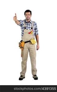 artisan in overalls against white background