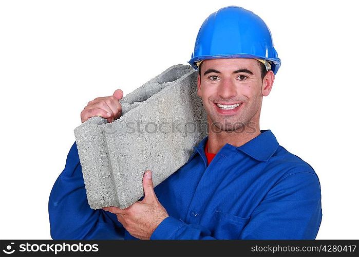 Artisan with concrete block on shoulder