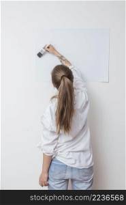 artist drawing picture paper wall