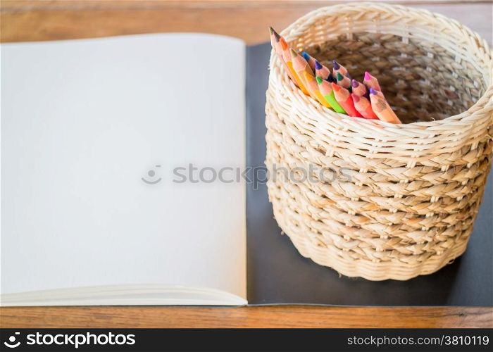 Artist sketchbook and colored pencils, stock photo