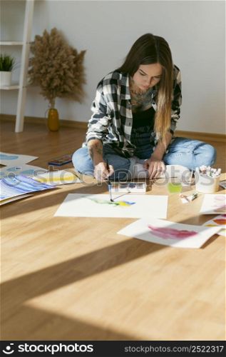 artist woman painting floor